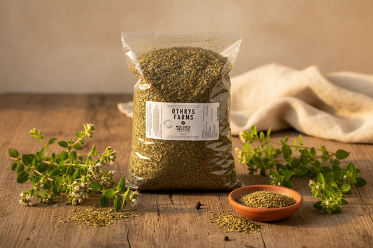 Othrys Wild Greek Oregano 1 lb bag flat lay with dried oregano, ceramic dish, and fresh branches on rustic wooden surface